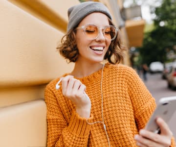 girl with phone and headphones